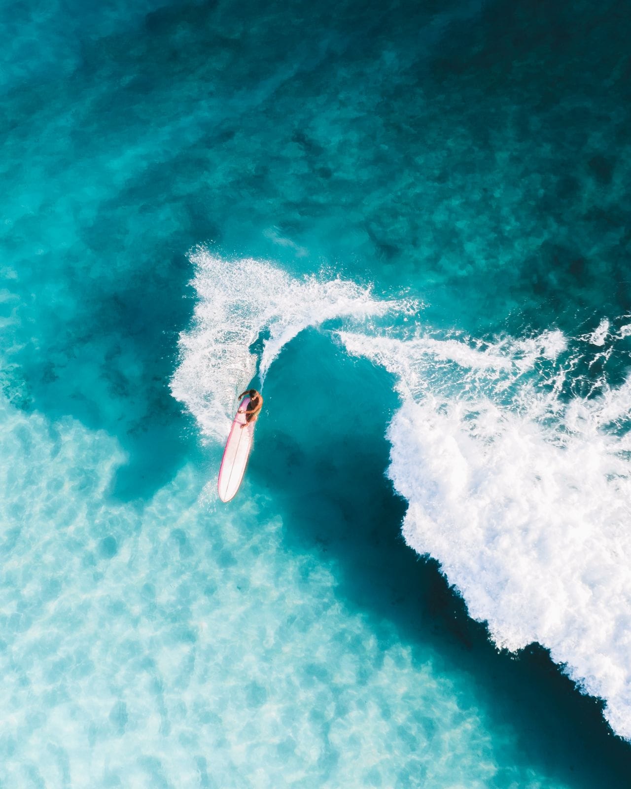 Surfer riding a wave at Cloud 9, Siargao